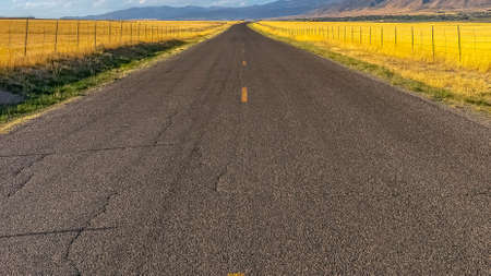 Road passing through a scenic landscape in Utahの写真素材