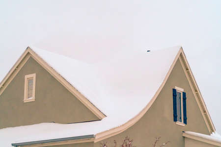 Home with snow covered roof in Daybreak Utahの写真素材