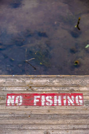 No Fishing sign on wooden deck over water in Provoの写真素材
