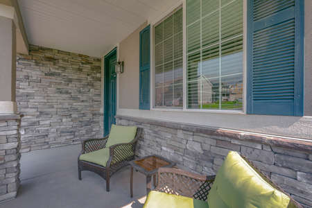 Porch with armchairs and windows with reflectionsの写真素材