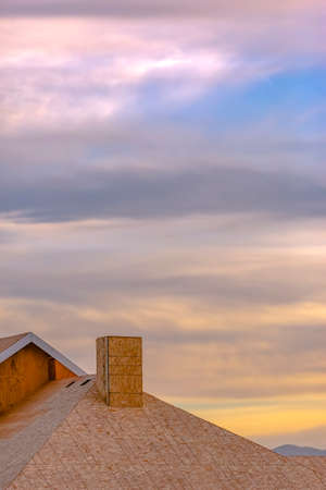 Roof of a home under construction against skyの写真素材