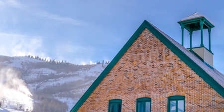 Snowy building and mountain in Park City Utahの写真素材