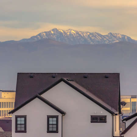 Utah homes and buildings against mountain and skyの写真素材