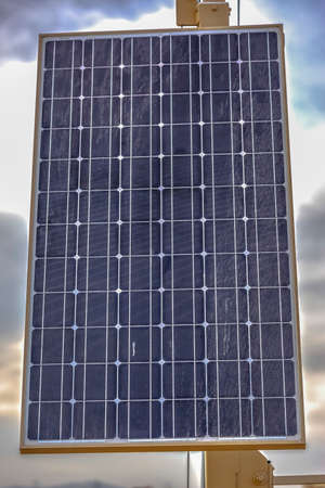 Solar panel with cloudy sky background in Utah