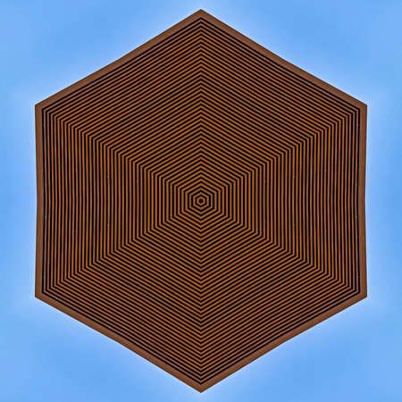 Badge design made from a metal side panels. Geometric kaleidoscope pattern on mirrored axis of...