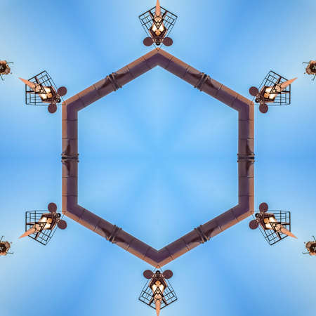 Decorative metal abstract shapes in a circle. Geometric kaleidoscope pattern on mirrored axis of...