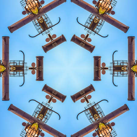 Metal industrial building made into abstract design. Geometric kaleidoscope pattern on mirrored axis...
