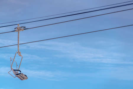 Chair lift on a ski resort in Park City Utah. Chair lift over snow covered mountain on a ski resort...