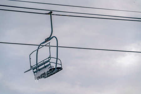 Chair lift with snow and icicles in Park City Utahの写真素材