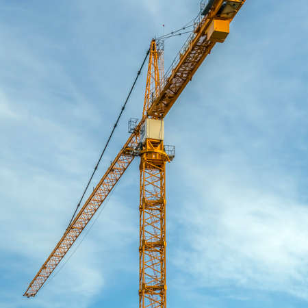 A Construction tower crane with sky backgroundの写真素材
