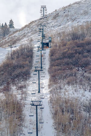 Ski lifts overlooking a snow covered mountain