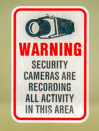Warning sign on an area with security camerasの写真素材