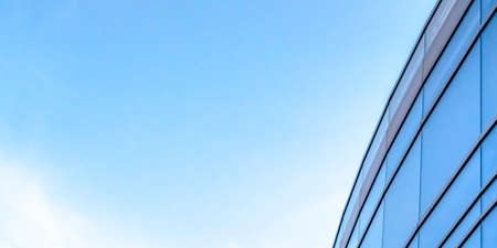 Bright sky and blue glass windows of a building