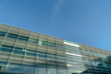 Facade of a modern building against blue sky