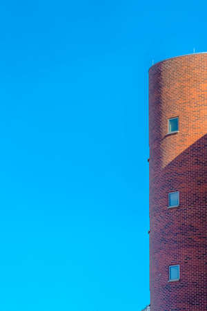 Cylindrical building against sky on a sunny dayの写真素材
