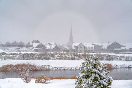 Snow covered lakeside in Daybreak Utah in winterの写真素材
