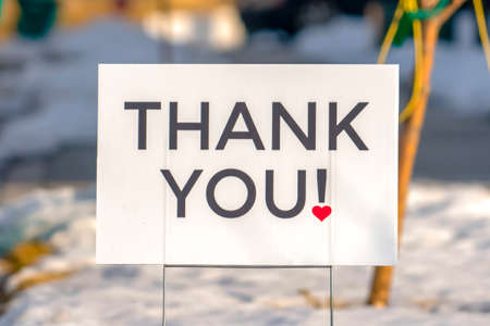 Thank You sign isolated against blurred background