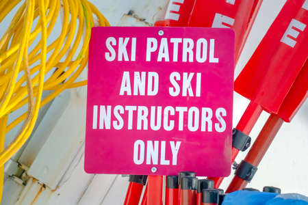 Ski Patrol and Ski Instructors Only sign in Utah. Close up of a signage on a sunny winter day in...