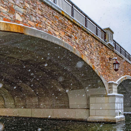 Clear Square Snowy view under the arched bridge of Oquirrh Lakeの写真素材