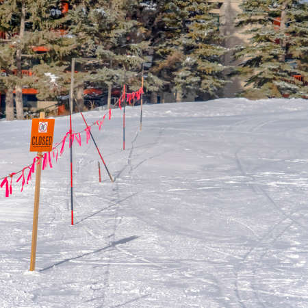 Closed sign and barricade against a ground covered with dense snow in Park Cityの写真素材