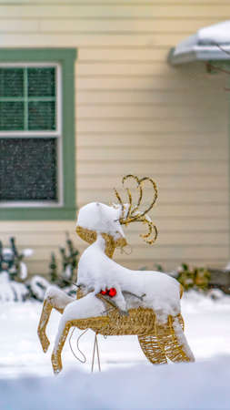 Vertical Reindeer Christmas decoration on the yard of a home in Daybreak Utahの写真素材