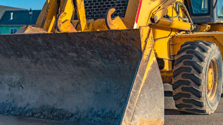 Clear Panorama Close up of a construction machinery parked on the road on a sunny day. A...