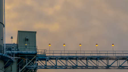 DELAY : 10Power Plant in Utah Valley against vast sky with puffy clouds at sunset. Thin smoke can be...