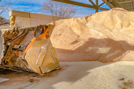 Bucket of a heavy duty machinery at a construction site on a sunny day
