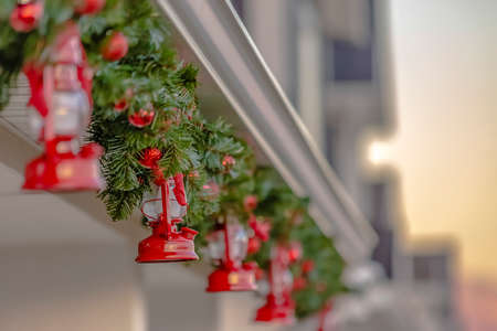 Exterior of a festive house decorated with a traditional Christmas garland
