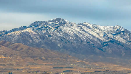 Panorama Panorama of a majestic mountain with sky and clouds in the backgroundの写真素材