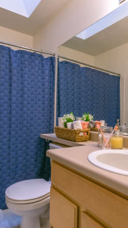 Panorama frame Interior of a small and cozy bathroom with a single vanity unit and toilet