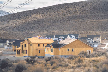 Residential area with view of the hill and cloudy sky in the background