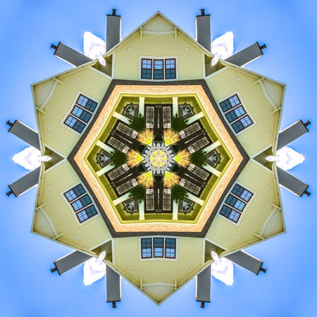 Suburban home with windows and chimney sky. Geometric kaleidoscope pattern on mirrored axis of...