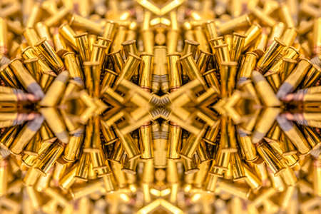 Pile of bullets on two separate axises. Geometric kaleidoscope pattern on mirrored axis of symmetry reflection. Colorful shapes as a wallpaper for advertising background or backdrop.の写真素材