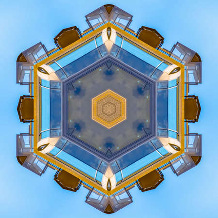 Star shape made from the decks and windows. Geometric kaleidoscope pattern on mirrored axis of symmetry reflection. Colorful shapes as a wallpaper for advertising background or backdrop.の写真素材