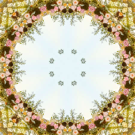 Circular floral design made from flowers at a wedding in California. Geometric kaleidoscope pattern on mirrored axis of symmetry reflection. Colorful shapes as a wallpaper for advertising background or backdrop.の写真素材