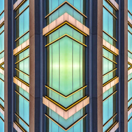 Shiny exterior windows of an office building. Geometric kaleidoscope pattern on mirrored axis of...