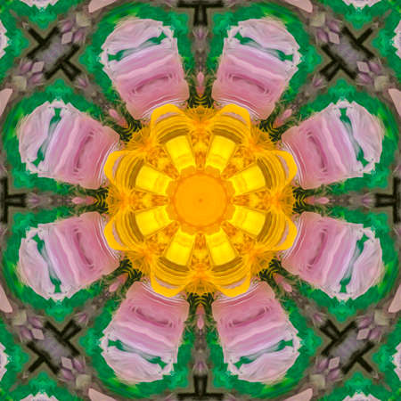 Digital flower with purple petals and yellow center. Geometric kaleidoscope pattern on mirrored axis of symmetry reflection. Colorful shapes as a wallpaper for advertising background or backdrop.の写真素材
