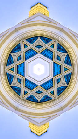 Vertical A white temple church with windows reflectedの写真素材