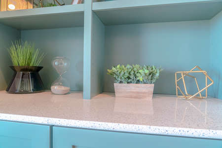 Decorative plants and decor on modern marble benchの写真素材