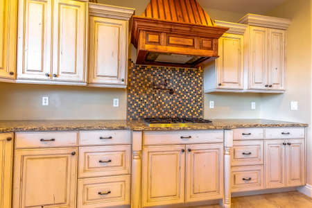 Modern fitted kitchen with granite counters inside