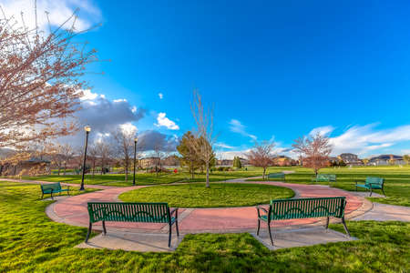 Circular walkway in a park with empty benches