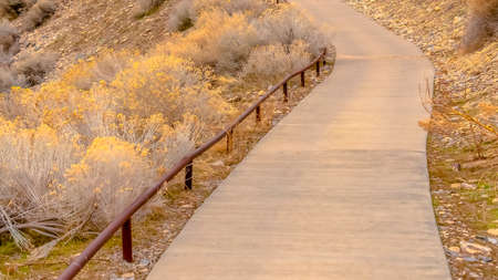 Panorama frame Steep footpath or hiking trail climbing a mountainの写真素材