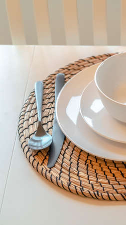 Vertical Modern dinner setting with cutlery and crockery