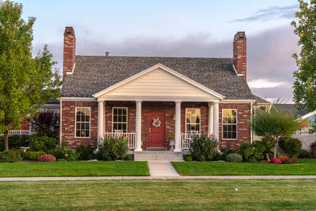 Modern face brick townhouse front facade near sunset. Modern face brick townhouse front facade...
