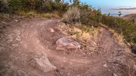 Panorama frame Hiking trail taking a sharp U-turn in Utah. Hiking trail on a mountain taking a sharp...
