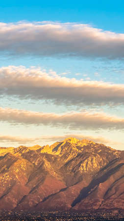 Vertical Panorama view of Mount Timpanogos at sunset. Panorama view of Mount Timpanogos in the Wasatch Range in Utah USA at sunset during golden hourの写真素材