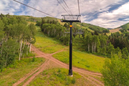Intersecting hiking trails and metal chairlifts viewed in Park City in summerの写真素材