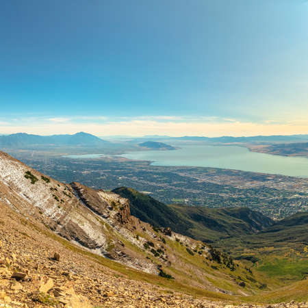 Square frame Sun shining over Utah valley panorama at the summit looking downの写真素材