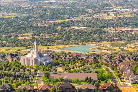 Temple and geart shaped lake amid buildings and houses in Salt Lake City Utahの写真素材